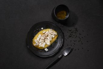 Fresh goat's cheese on a bed of mango